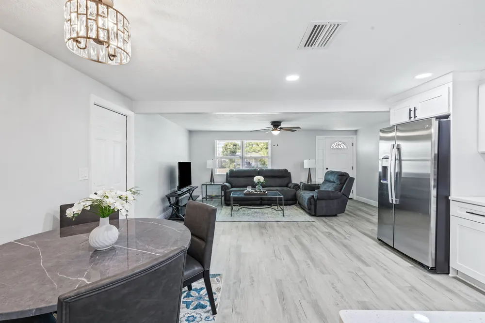 Open-plan dining and living area after a whole-home interior remodel